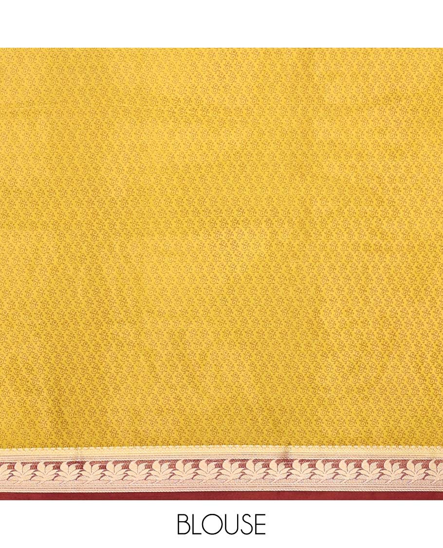 Yellow intricately printed semi-banaras printed saree, contrast floral border & intricate pallu