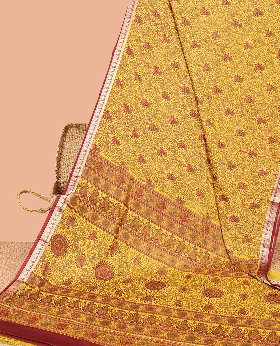 Yellow intricately printed semi-banaras printed saree, contrast floral border & intricate pallu