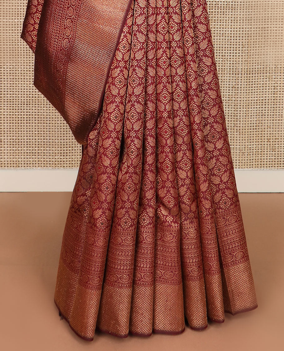 Maroon Jacquard Kanchipuram silksaree,zari border of reeku,paisa,banaras,kodi visiry,neli,manga,lavangam & mayil kann & intricate pallu