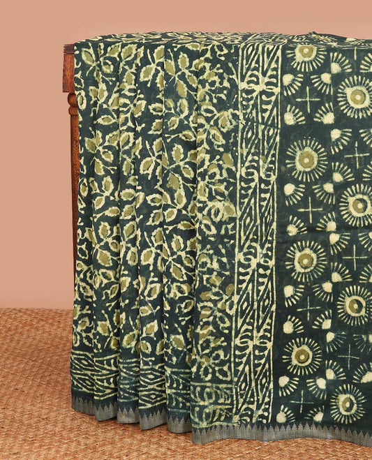 Green batik floral vine printed mul mul cotton saree, geometric printed border, and floral printed pallu