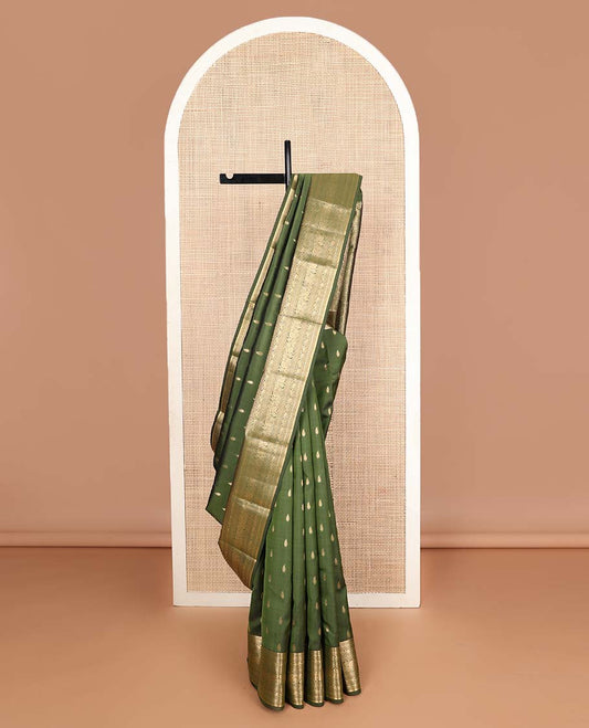 Green zari buttas Vasundhara silk mix saree, zari border of rekku,muthu & kodi siry designs & chakram motifs steeped pallu