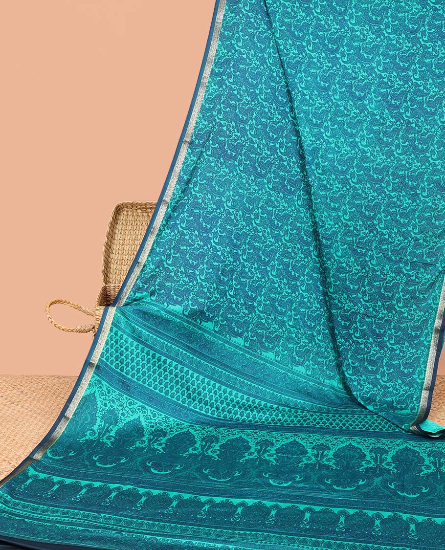 Blue paisley printed semi-banaras printed saree, contrast zari border & intricate pallu