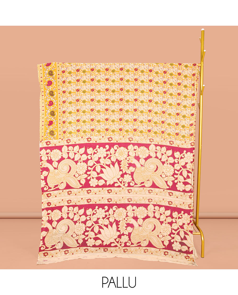 Yellow Machine-Printed Kalamkari Cotton Saree, Decked Up with Batik Vines on Its Body, Highlighted by a Self-Border of Batik Paisley Print, Pallu of Floral-Peacock Print, and Paired with a Printed Blouse