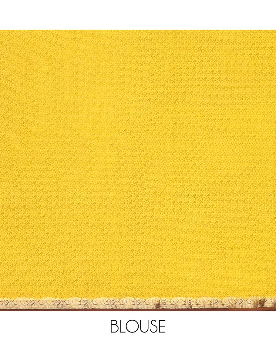 Yellow intricately printed semi-banaras printed saree, contrast zari border & intricate pallu