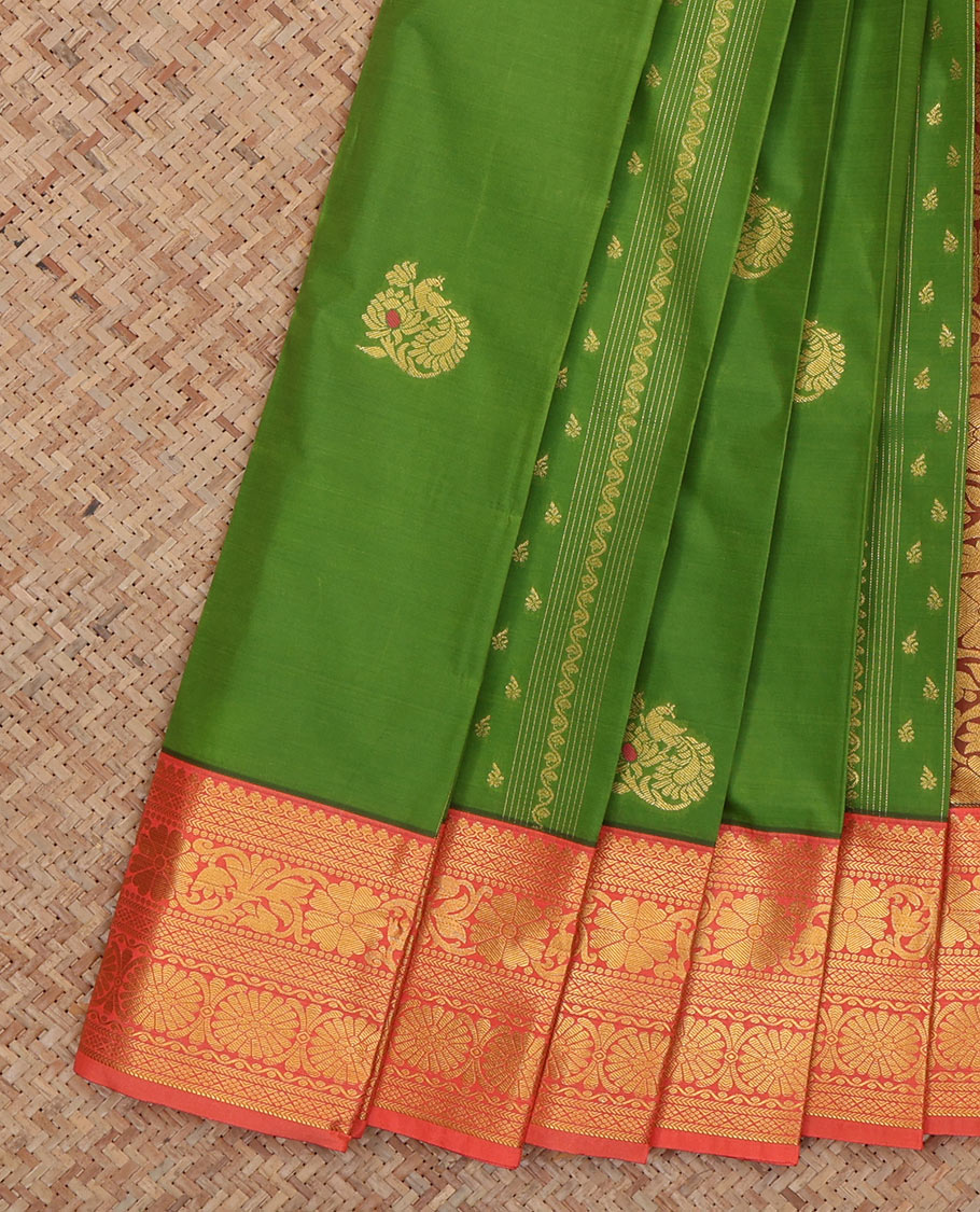 Green Budget Silk Saree Features Zari Buttas, Complemented by Contrast Traditional Zari Border, a Grand Pallu and a Contrast Blouse