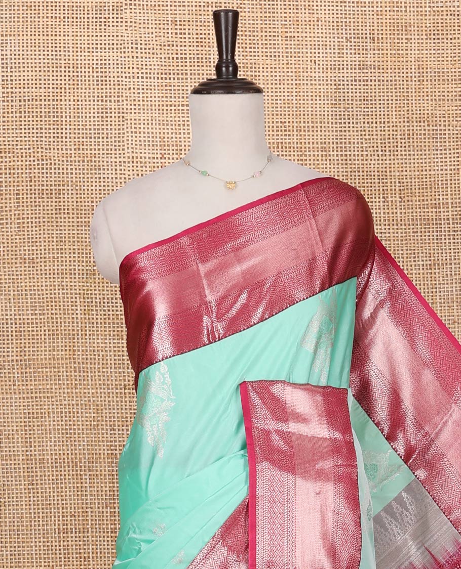 Turquoise Budget Silk Saree, Elegantly Framed with Zari Buttas on Its Body, Complemented by a Contrast Traditional Zari Design Border, Floral Design Pallu, and Paired with a Contrast Blouse