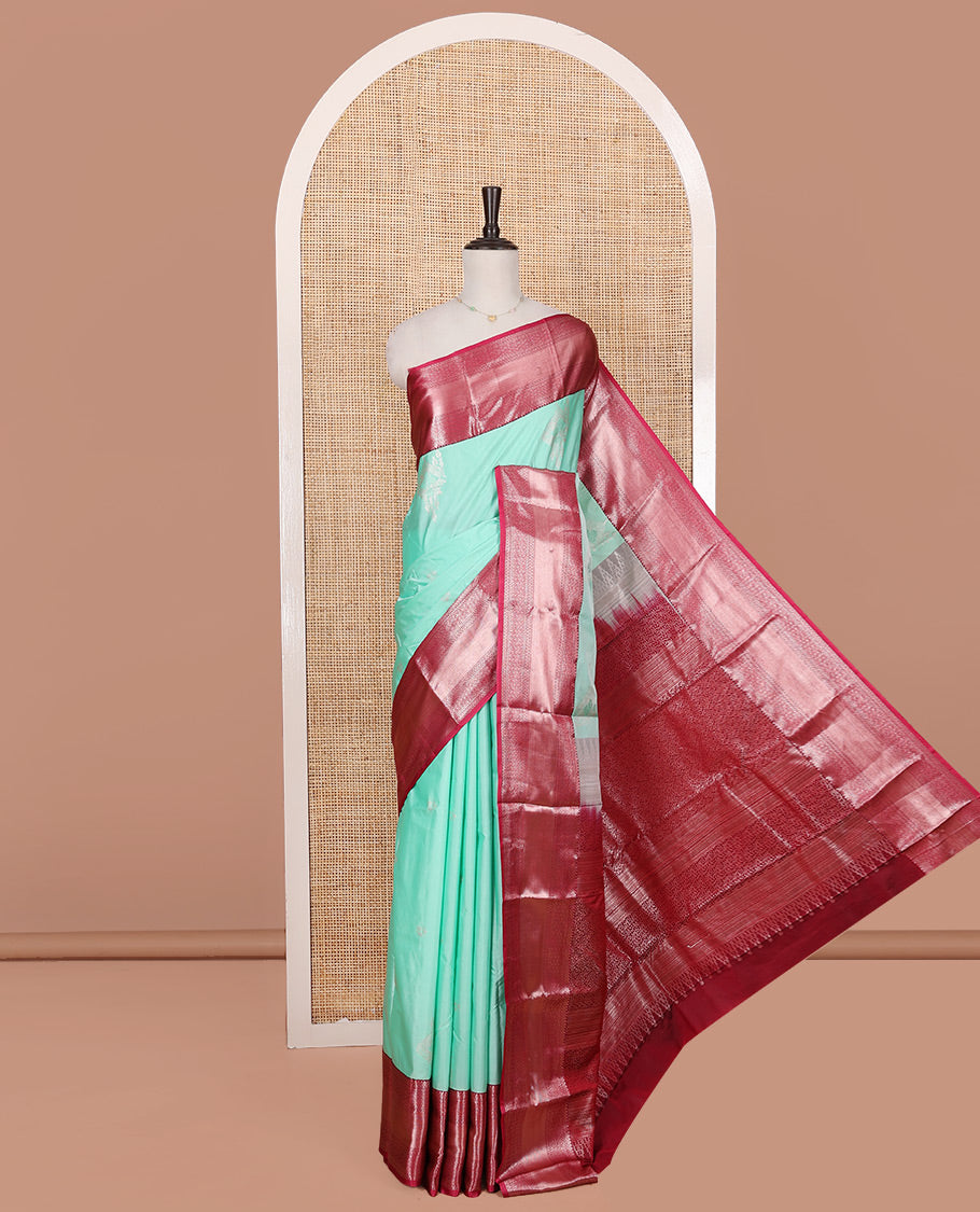 Turquoise Budget Silk Saree, Elegantly Framed with Zari Buttas on Its Body, Complemented by a Contrast Traditional Zari Design Border, Floral Design Pallu, and Paired with a Contrast Blouse