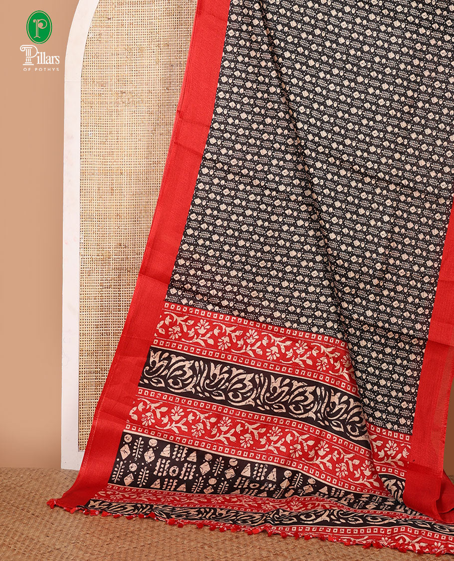 Black batik-style geometric motifs block printed khadi cotton saree,contrast border, batik floral print pallu & plain red blouse