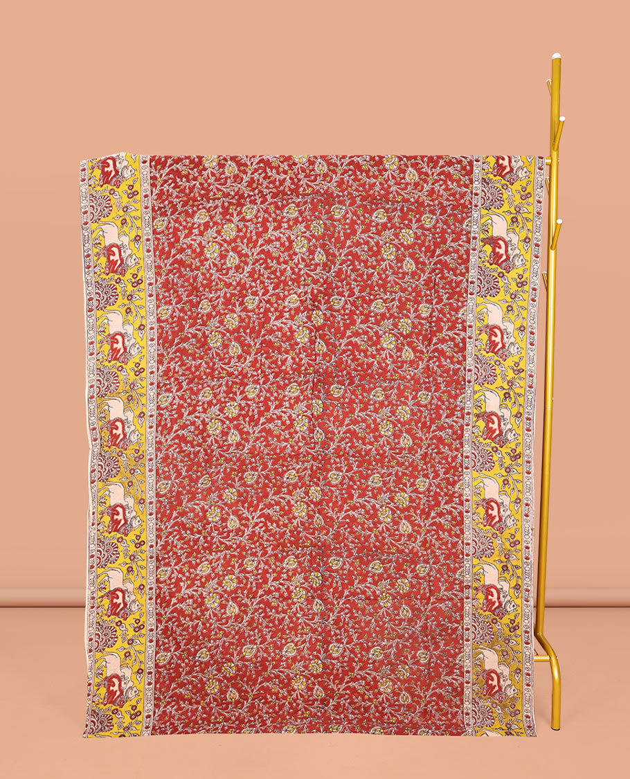 Maroon Machine-Printed Kalamkari Cotton Saree, Featuring Floral Vines on Its Body, Complemented by a Contrast Border of Pichwai Cow Print, Pallu of Peacock Print, and Paired with a Printed Blouse