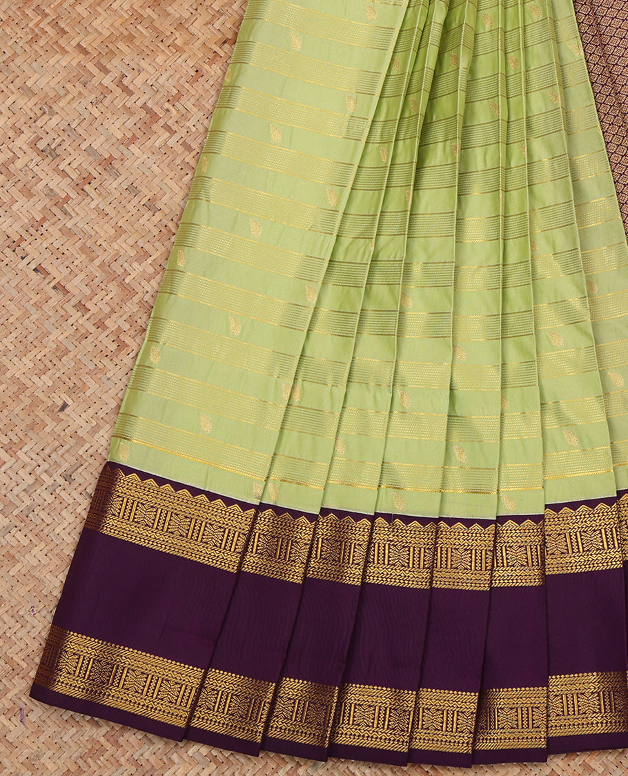 Green Budget Silk Saree, Gleamed Up with Zari Buttas and Stripes, a Contrast Traditional Zari Rettai Pettu Border, Grand Pallu, and a Contrast Blouse