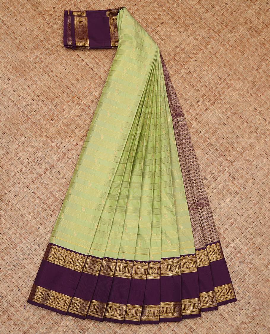Green Budget Silk Saree, Gleamed Up with Zari Buttas and Stripes, a Contrast Traditional Zari Rettai Pettu Border, Grand Pallu, and a Contrast Blouse