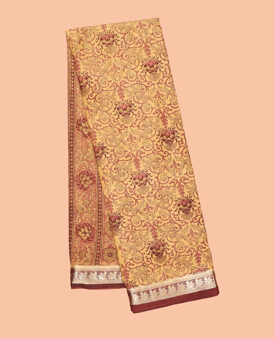 Orange intricately printed semi-banaras printed saree, contrast floral border & intricate pallu