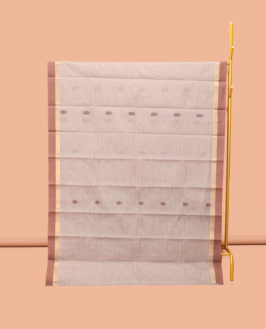 Chikku Kanchi Cotton Saree, Subtly Sparkled with Buttas, Complemented by a Contrast Border, Floral Pallu, and a Matching Blouse
