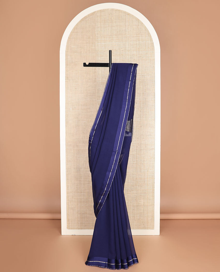 Navy blue plain design pure chiffon saree, zari border of neli kathir design, and pallu steeped with zari stripes