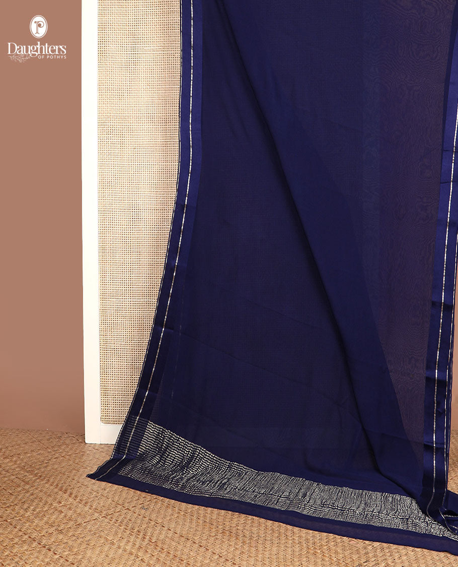 Navy blue plain design pure chiffon saree, zari border of neli kathir design, and pallu steeped with zari stripes