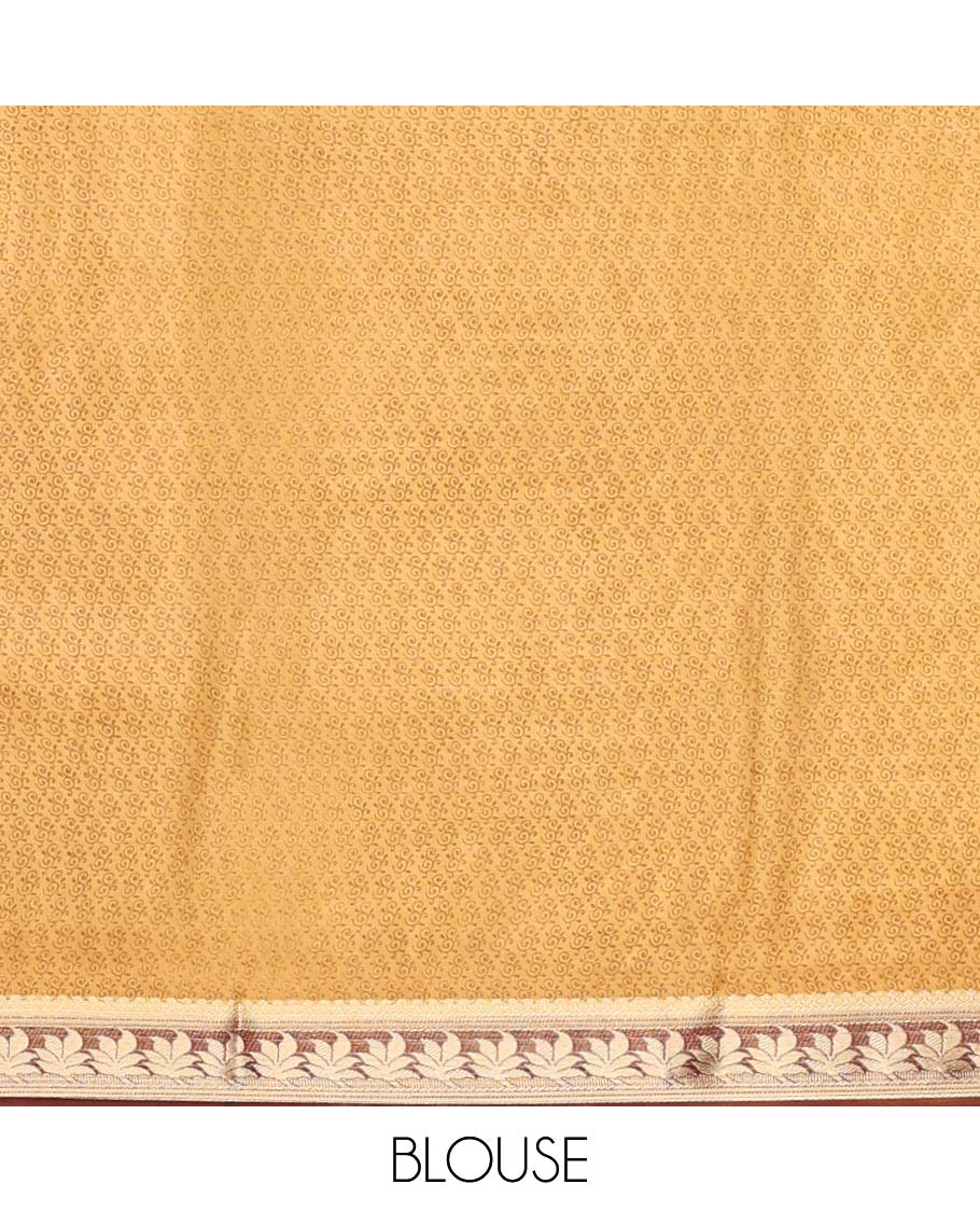 Orange intricately printed semi-banaras printed saree, contrast floral border & intricate pallu