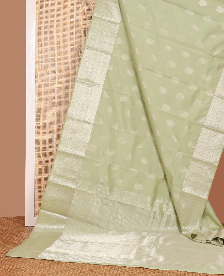 Pale green zari buttas Vasundhara silk mix saree, zari border of neli,kodi visiry,muthu, and vanki designs, and vanki pallu