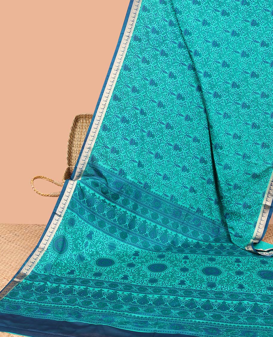 Blue intricately printed semi-banaras printed saree, contrast floral border & intricate pallu