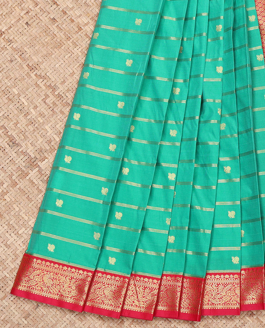 Green Budget Silk Saree, Ornamented with Peacock Buttas and Zari Stripes on Its Body, Complemented by a Contrast Traditional Zari Design Border, Grand Jaal Pallu, and Paired with a Contrast Blouse