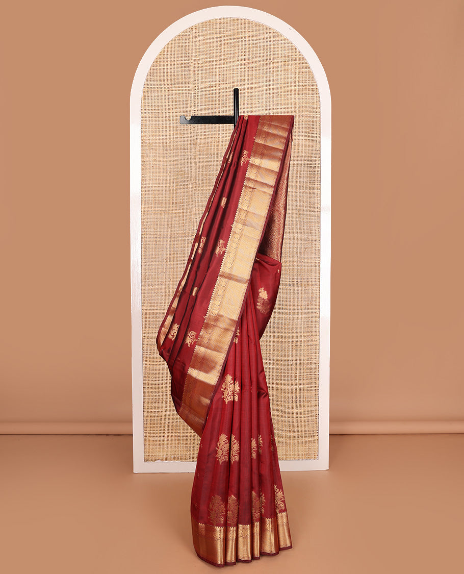 Maroon zari buttas Vasundhara silk mix saree, zari border of thilakam mokku, kodi viisry, and mayil kann, and pallu of iruthalai pakshi and geometric pattrens