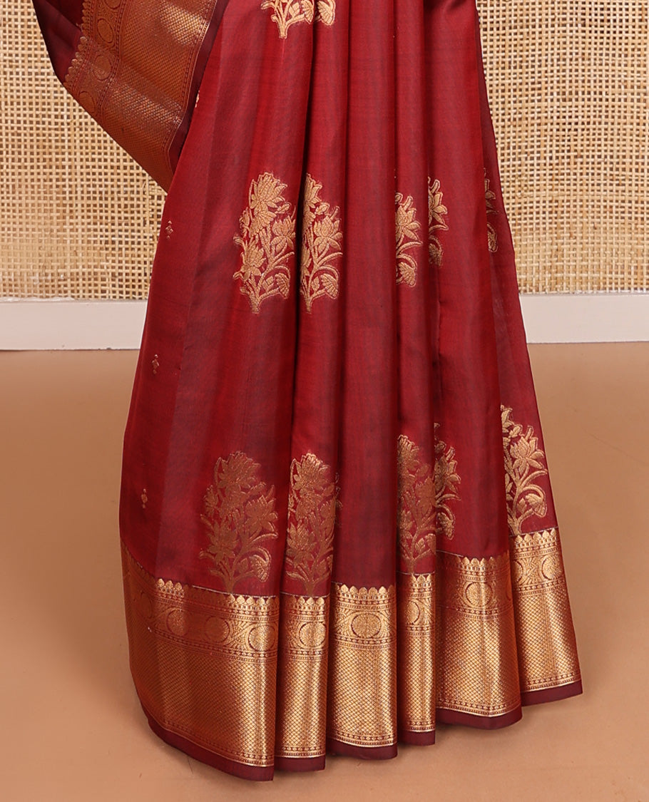 Maroon zari buttas Vasundhara silk mix saree, zari border of thilakam mokku, kodi viisry, and mayil kann, and pallu of iruthalai pakshi and geometric pattrens
