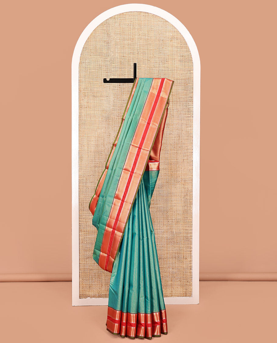 Green Vasundhara Lite Silk Saree, Gleamed up with Zari Vaira Oosi Stripes All Over Its Body, Complemented by Contrast Rettai Pettu Border of Ara Maadam Designs, Grand Pallu and Paired with a Contrast Blouse