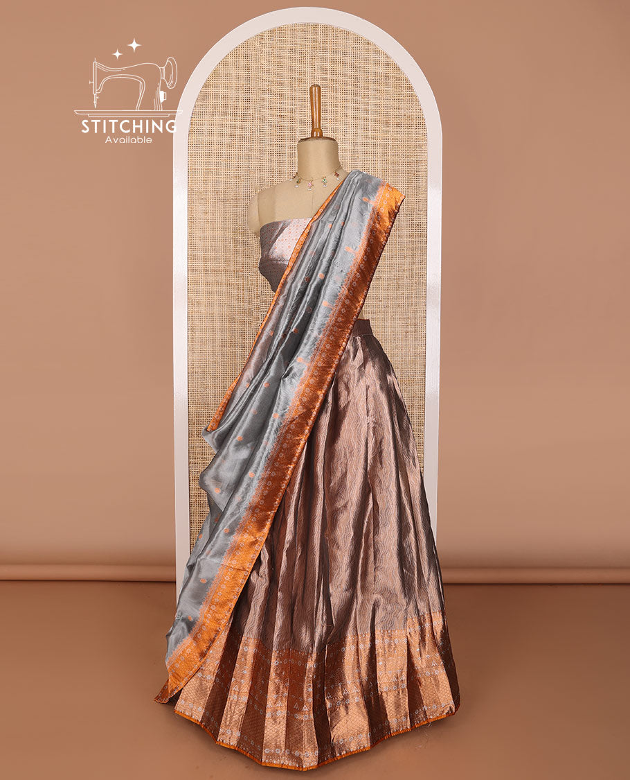 Brown tissue half saree with contrast intricate zari design border, zari design blouse & floral design dhavani