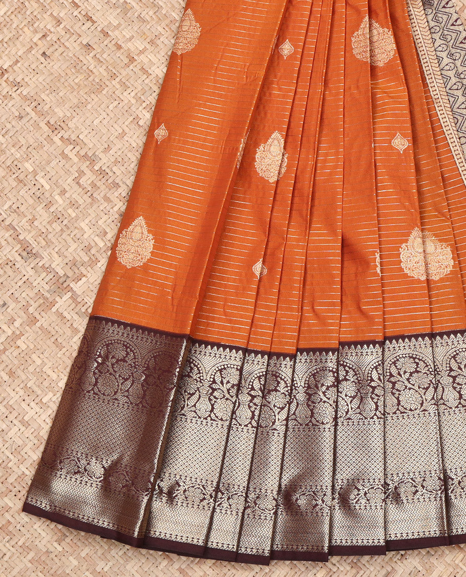 Rust Budget Silk Saree, Ornamented with Zari Buttas and Zari Stripes on Its Body, Complemented by a Contrast Traditional Zari Design Border, Pallu of Paisley and Chevron Stripes, and Paired with a Contrast Blouse