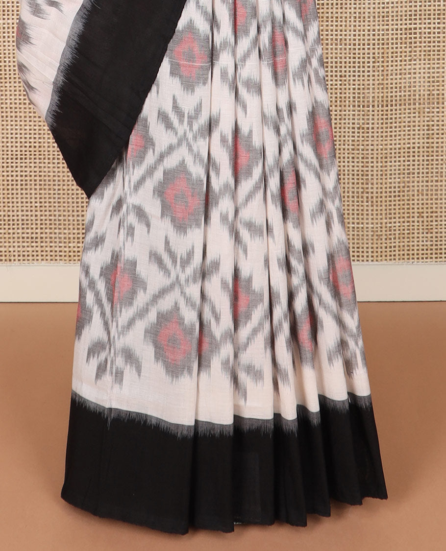 Half-white geometric design Pochampally ikkat saree, contrast plain black border, and ikkat design pallu
