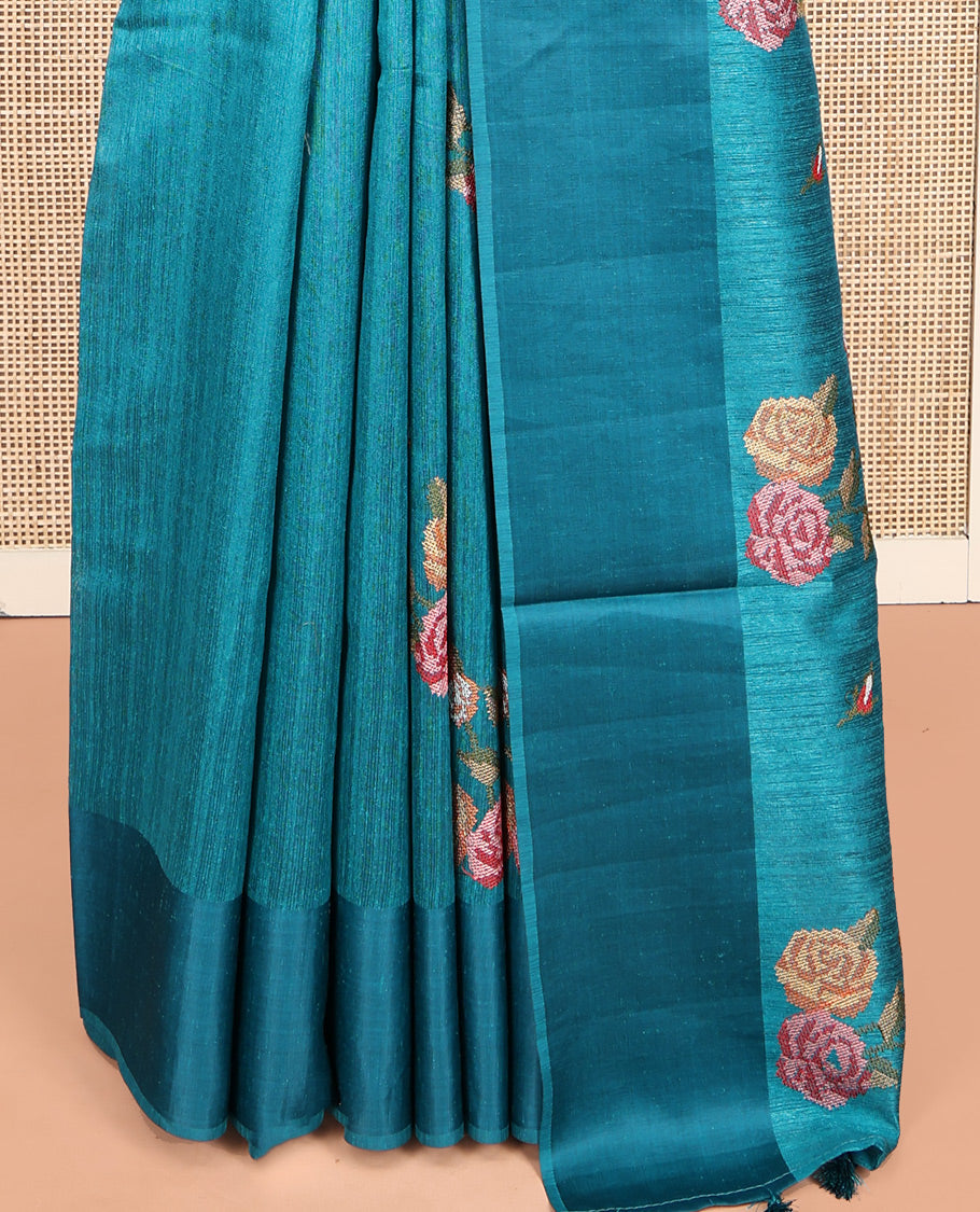 Rama Blue Green-Silk Saree, Colorfully Highlighted with Rose Motifs Cross Stitch Embroidery on Its Body, Subtly Sparkled by a Plain Border, Pallu of Rose Cross Stitch Embroidery, and Paired with a Contrast Blouse