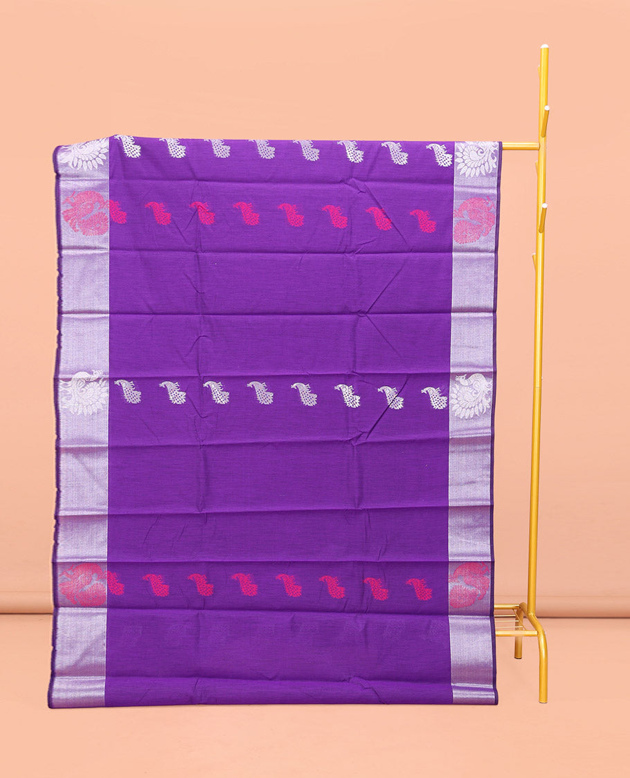 Violet Semi-Silk Cotton Saree, Embellished with Peacock Buttas All Over Its Body, Complemented by a Contrast Border of Peacock Designs, Pallu Steeped with Peacock Zari Design, and Paired with a Matching Blouse