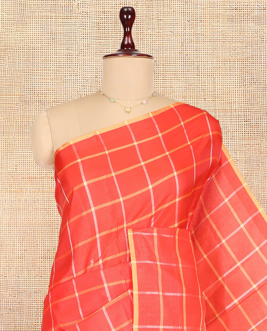 Borderless Red Checked Banana Pith Saree, a Contrast Pallu of Buttas and Stripes, and a Contrast Blouse