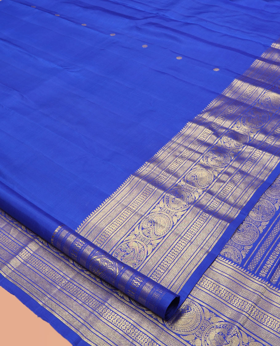 Blue Kanchipuram Silk Saree, Graced with Zari Buttas, Highlighted by Zari Border of Rekku, Vanki, Round Manga, and Round Mayil, Zari Design Pallu, and Matching Blouse