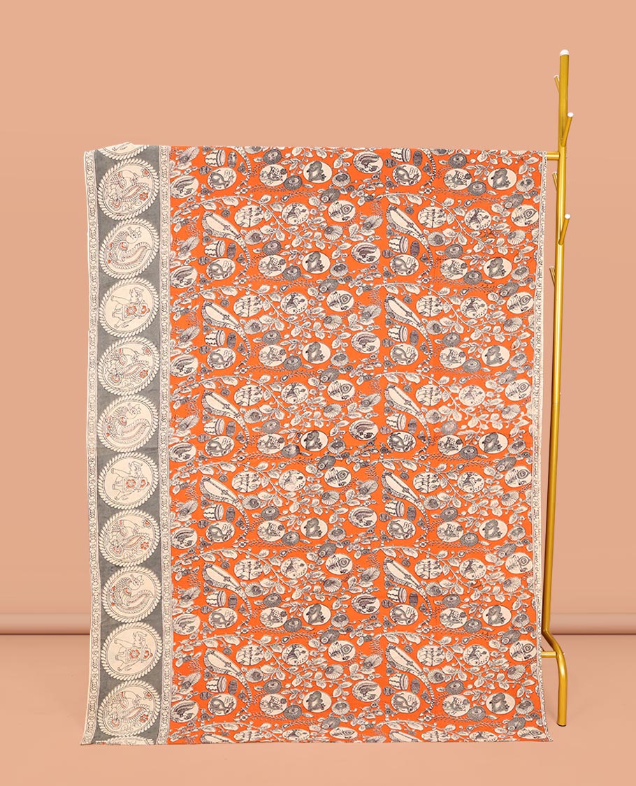 Orange Machine-Printed Kalamkari Cotton Saree, Embellished with Flora, Fauna, and Musical Instrument on Its Body, Complemented by a Contrast Round Motifs Printed Border, Pallu of Kalamakri Peacock Print, and Paired with a Printed Blouse