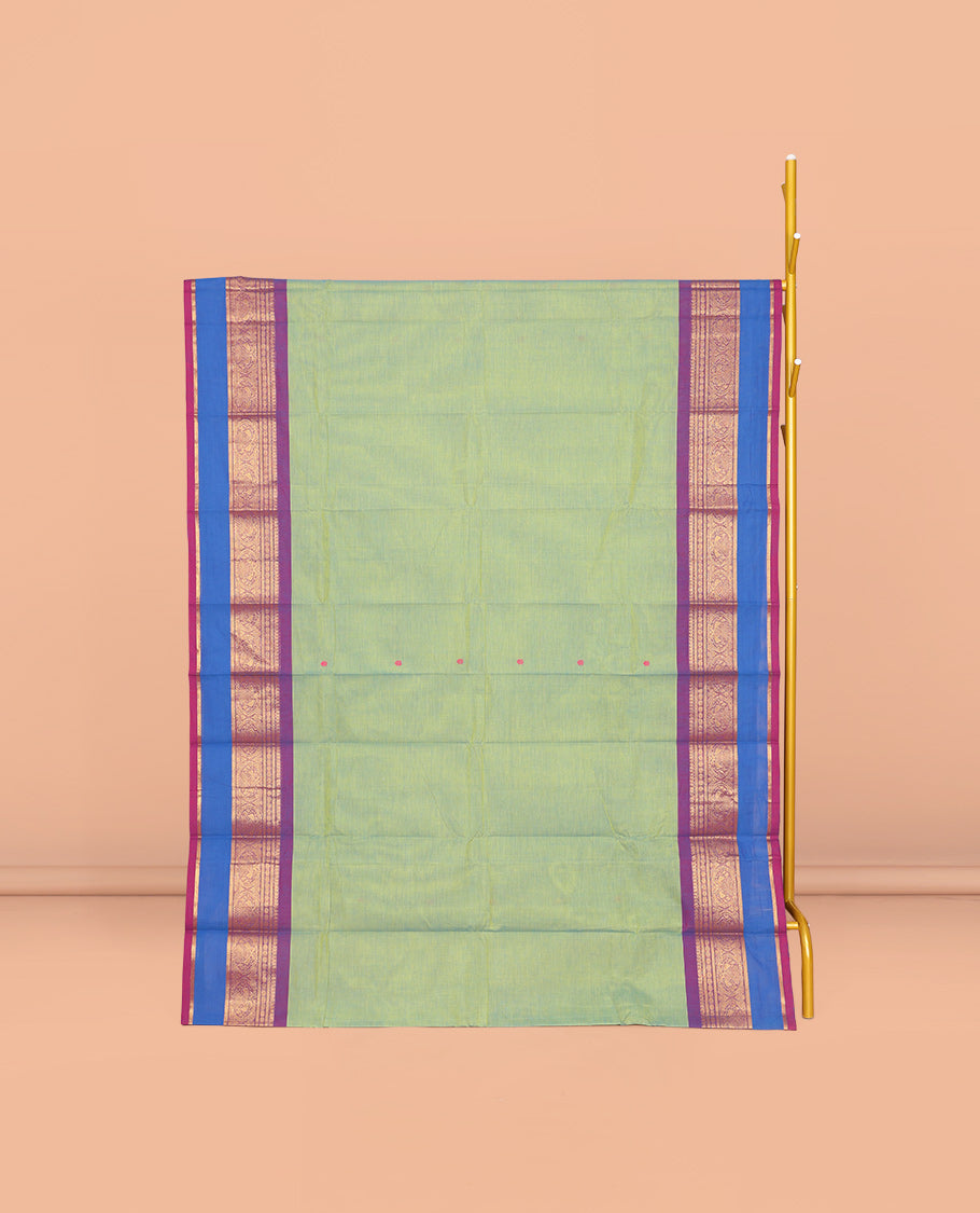 Green Chettinad Cotton Saree, Ornamented with Buttas All Over Its Body, Complemented by a Contrast Traditional Zari Rettai Pettu Border, Pallu of Stripes and Buttas, and Paired with a Matching Blouse