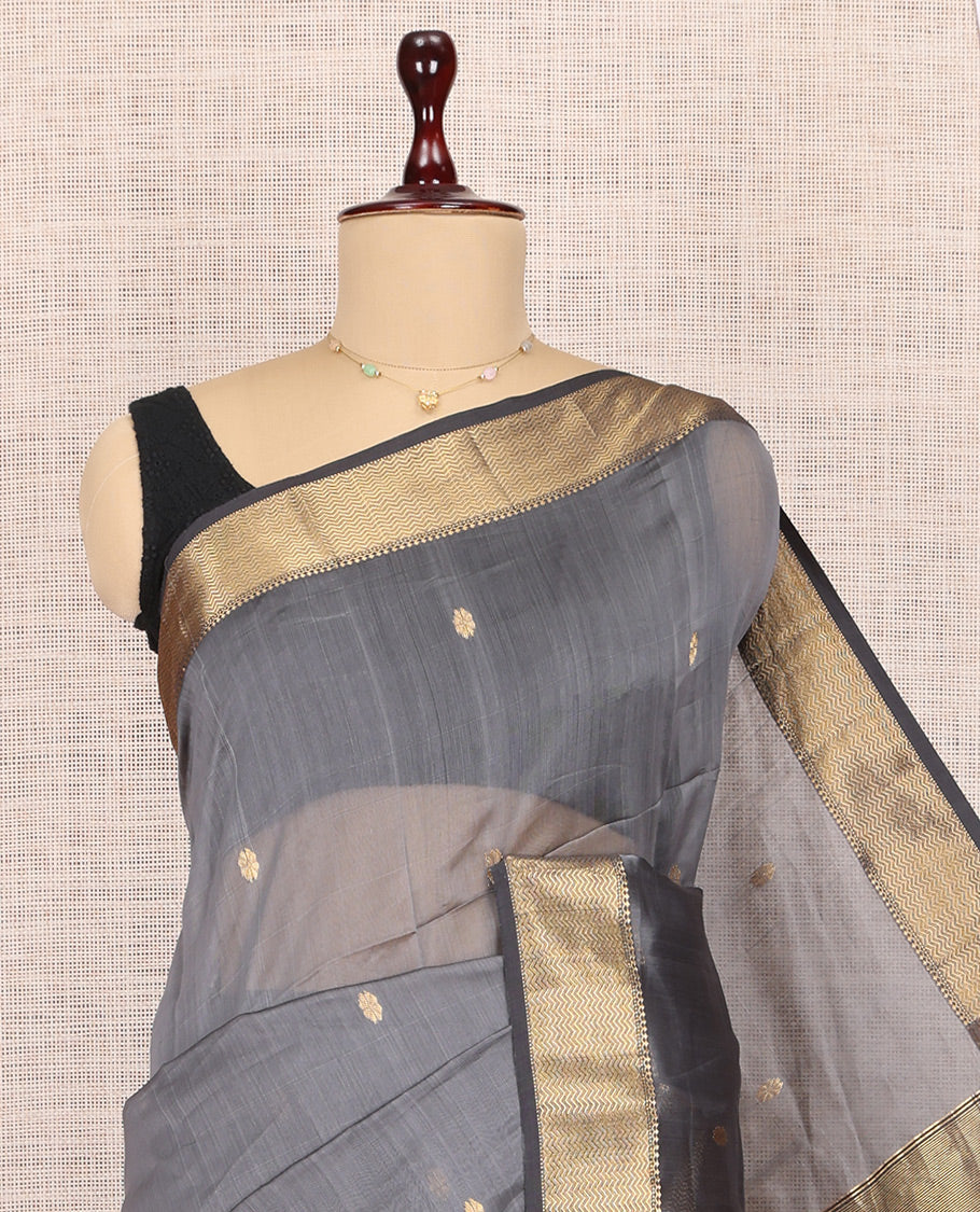Grey Maheshwari Cotton Saree, Embellished with Buttas, Highlighted by a Traditional Zari Border, Pallu Gleamed Up with Zari Buttas, and a Contrast Blouse