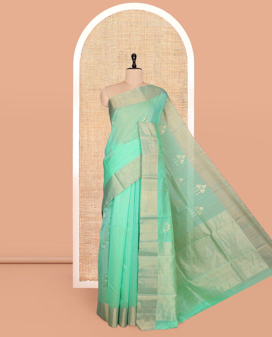 Green Silk Cotton Saree, Graced with Zari Buttas, a Zari Border, Gleaming Zari Pallu, and a Matching Blouse