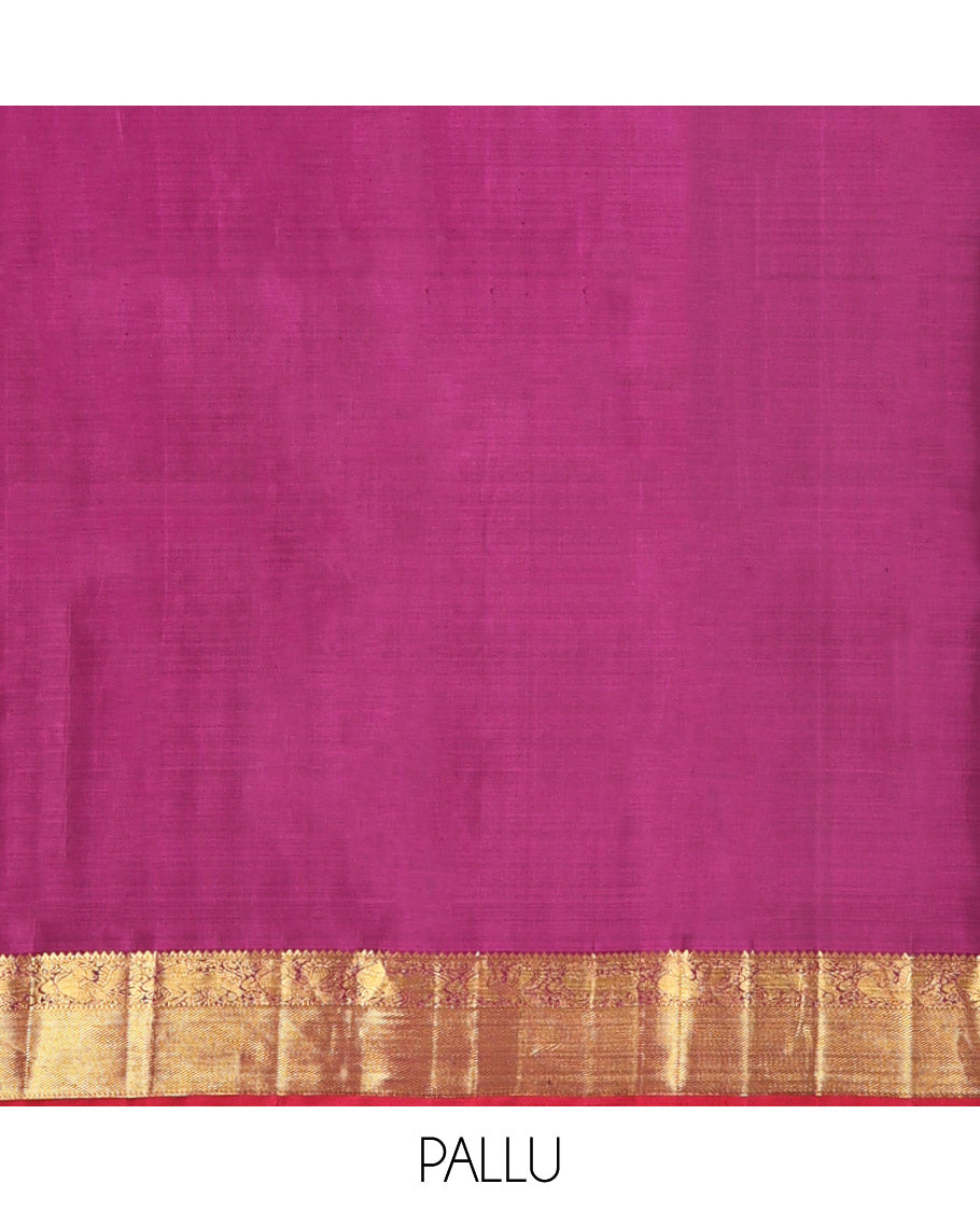 Orange Kanchipuram Silk Saree, Detailed with Chakram Buttas All Over Its Body, Complemented by Contrast Border of Rekku, Muthu, Mayil, and Yaali Designs, Pallu of Kodi Visiry and Lavangam Designs, and Paired with a Contrast Blouse