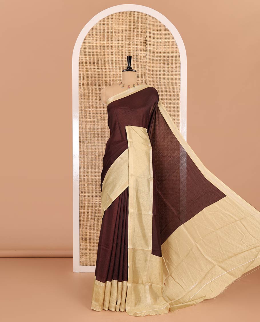 Brown embossed moss chiffon saree, contrast traditional rettai pettu border, embossed pallu, and a contrast embossed blouse