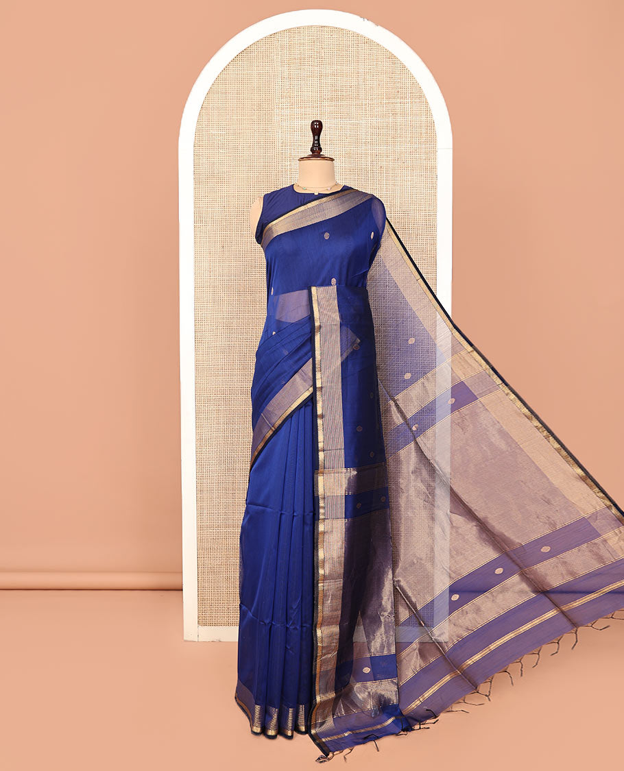 Blue Plain Maheshwari Cotton Saree, Mesmerized with Buttas All Over Its Body, Highlighted by a Zari Border of Traditional Designs, Gleaming Pallu Steeped with Zari Stripes, and Paired with a Matching Blouse