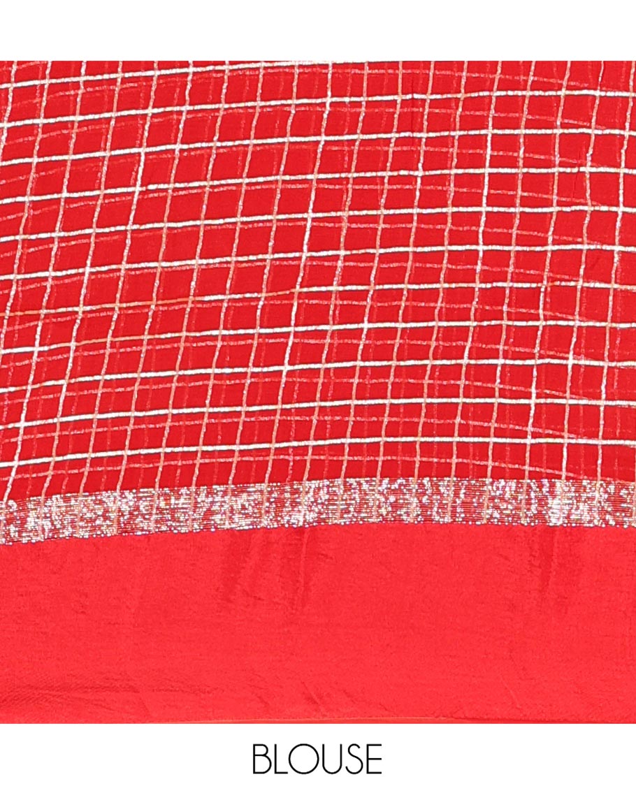 Red Viscose Georgette Saree Gleamed with Golden Zari Checks All Over Its Body, Adorned with a Satin Plain Border, a Self Pallu Featuring the Same Checks, and Paired with a Running Blouse