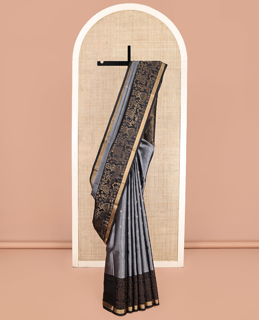 Grey Mayuri Soft Silk Saree, Subtly Sparkled with Zari Buttas, a Contrast Tribal-Themed Woven Border, Pallu of Forest-Themed Designs, and Contrast Blouse