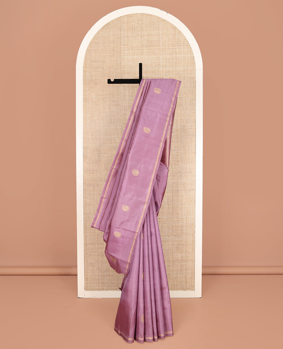 Pink Kanchipuram Silk Saree, Beautified with Arumbu Manga Zari Buttas All Over Its Body, Highlighted by a Zari Piping Border, Pallu of Jaal and Mayil Designs, and Paired with a Matching Blouse