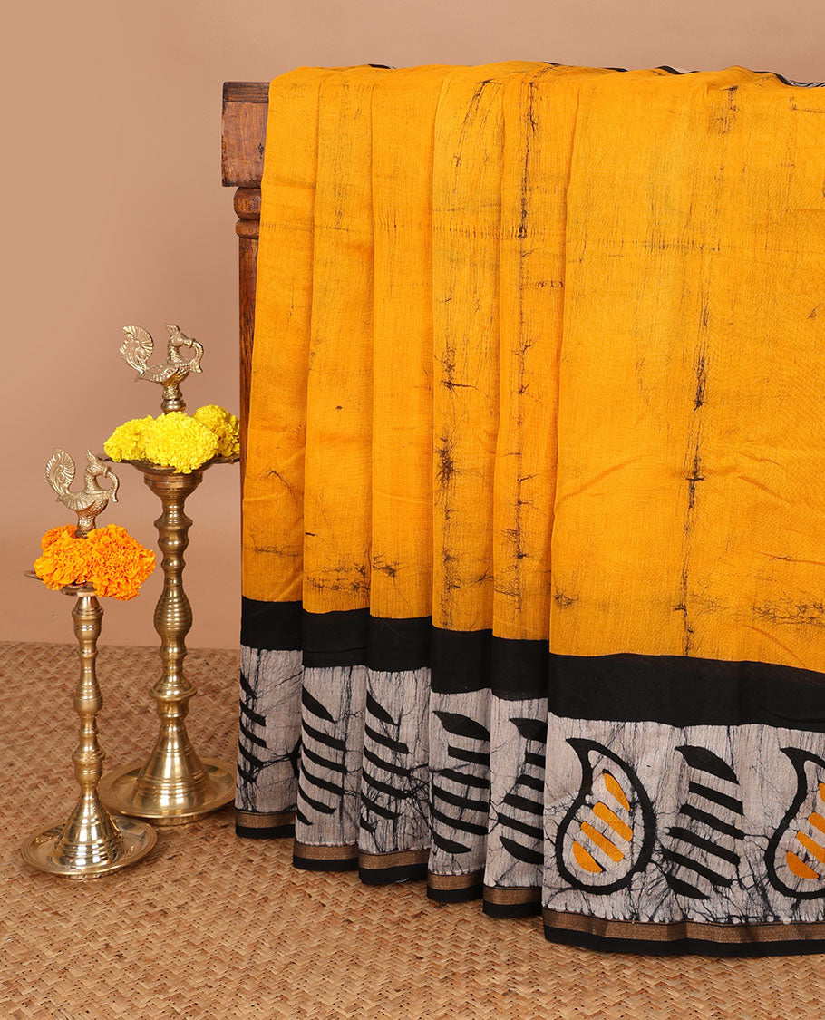 Mustard hand block batik printed chanderi cotton saree with black wax, checked border & black wax printed pallu along with plain blouse