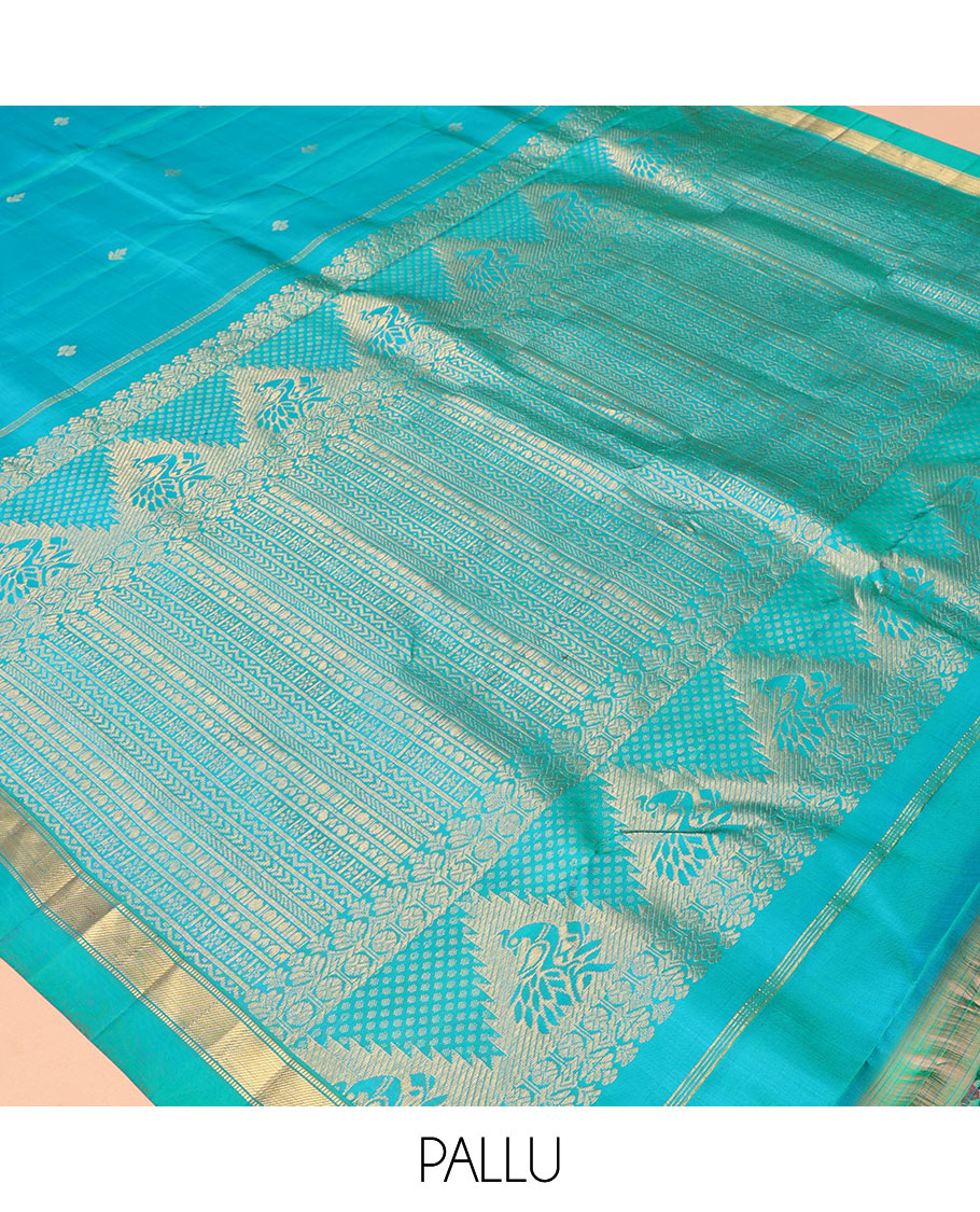 Blue Vasundhara Silk Saree, Subtly Sparkled with Zari Buttas, a Kal Eragina Border of Muthu Designs, Geometric Patterned Pallu, and a Matching Blouse