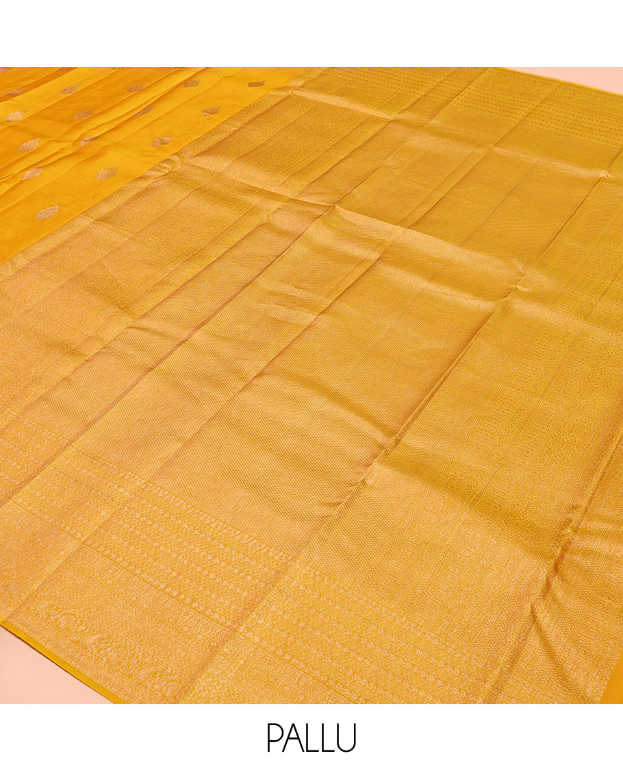 Yellow Kanchipuram Silk Saree, Subtly Sparkled with Zari Buttas All Over Its Body, Highlighted by a Zari Traditional Design Border, Grand Pallu, and Paired with a Matching Blouse