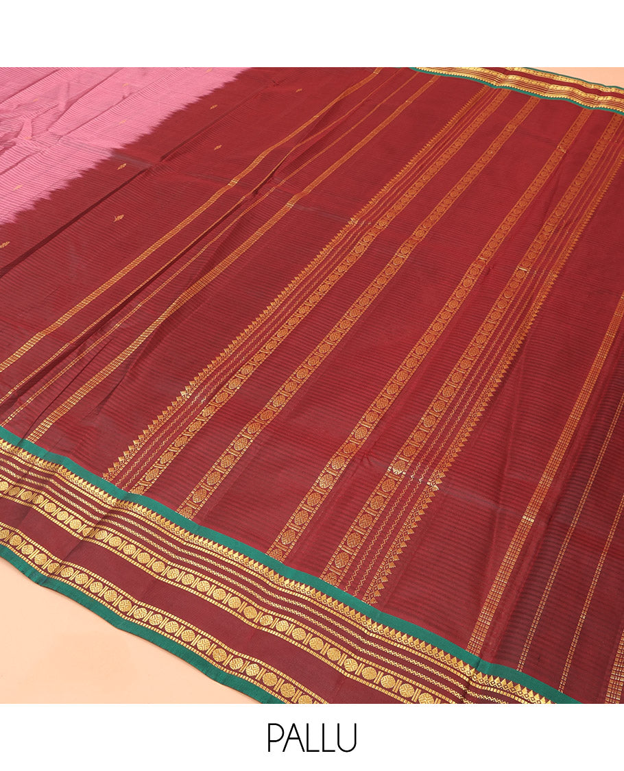 Rosewood Pink Kanchipuram Silk Saree Adorned with Vazhaipoo Stripes and Zari Buttas, Complemented by a Contrast Rettai Pettu Border Featuring Thazampoo Rekku, Muthu, Neli, and Rudraksham Designs, Gleaming Zari Pallu, and Paired with a Contrast Blouse