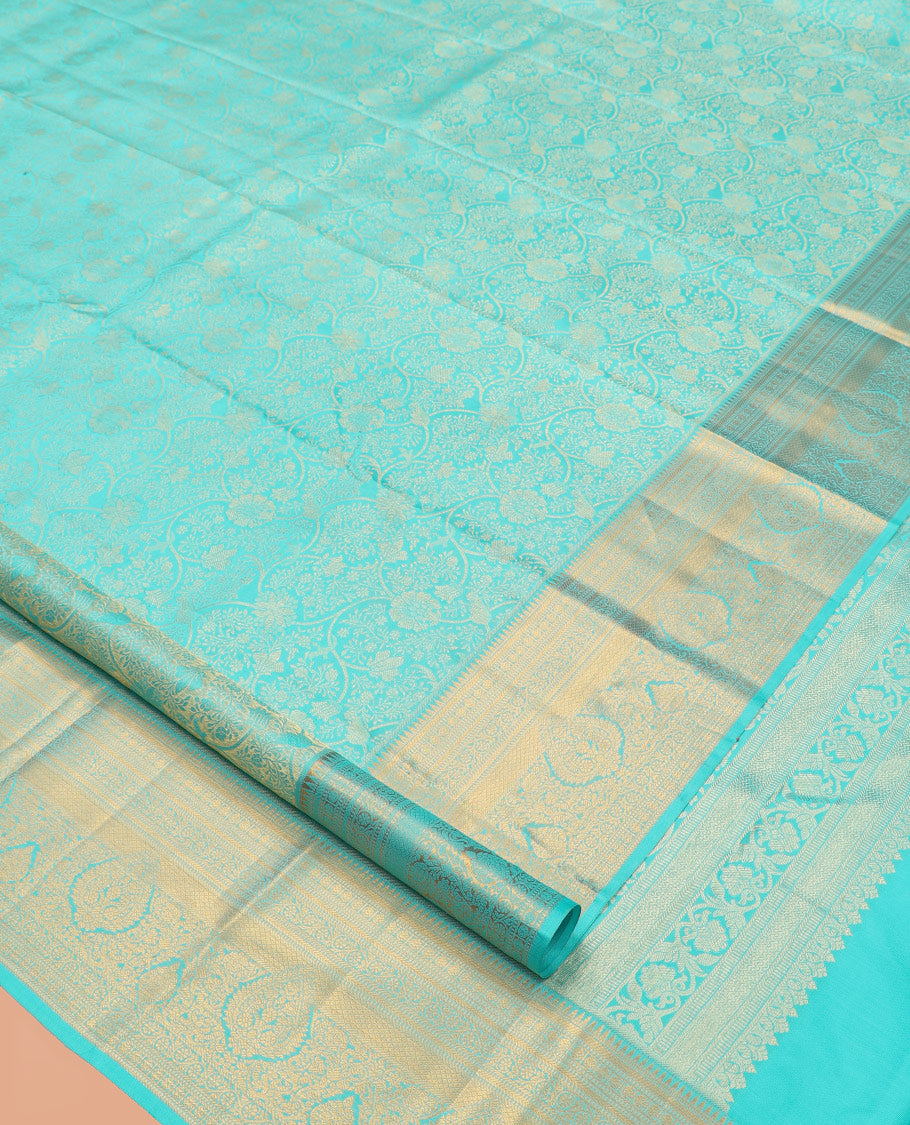 Turquoise Jacquard Kanchipuram Wedding Silk Saree, Highlighted by a Zari Border of Rekku, Muthu, Poun, Kodi Visiry, and Mayil Kann Designs, Grand Pallu, and Matching Blouse
