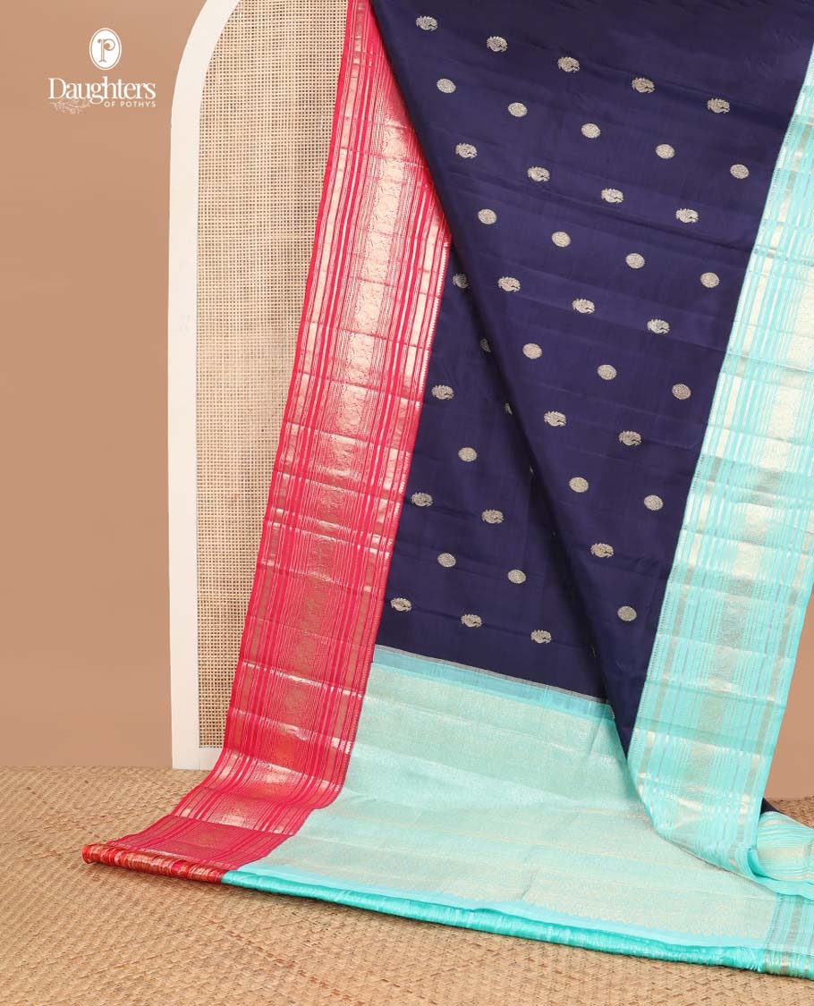 Dark blue buttas kancheepuram silk saree with contrast ganga jamuna, korvai border of thilakam mokku, muthu, banaras, mayil, manga design & zari design pallu