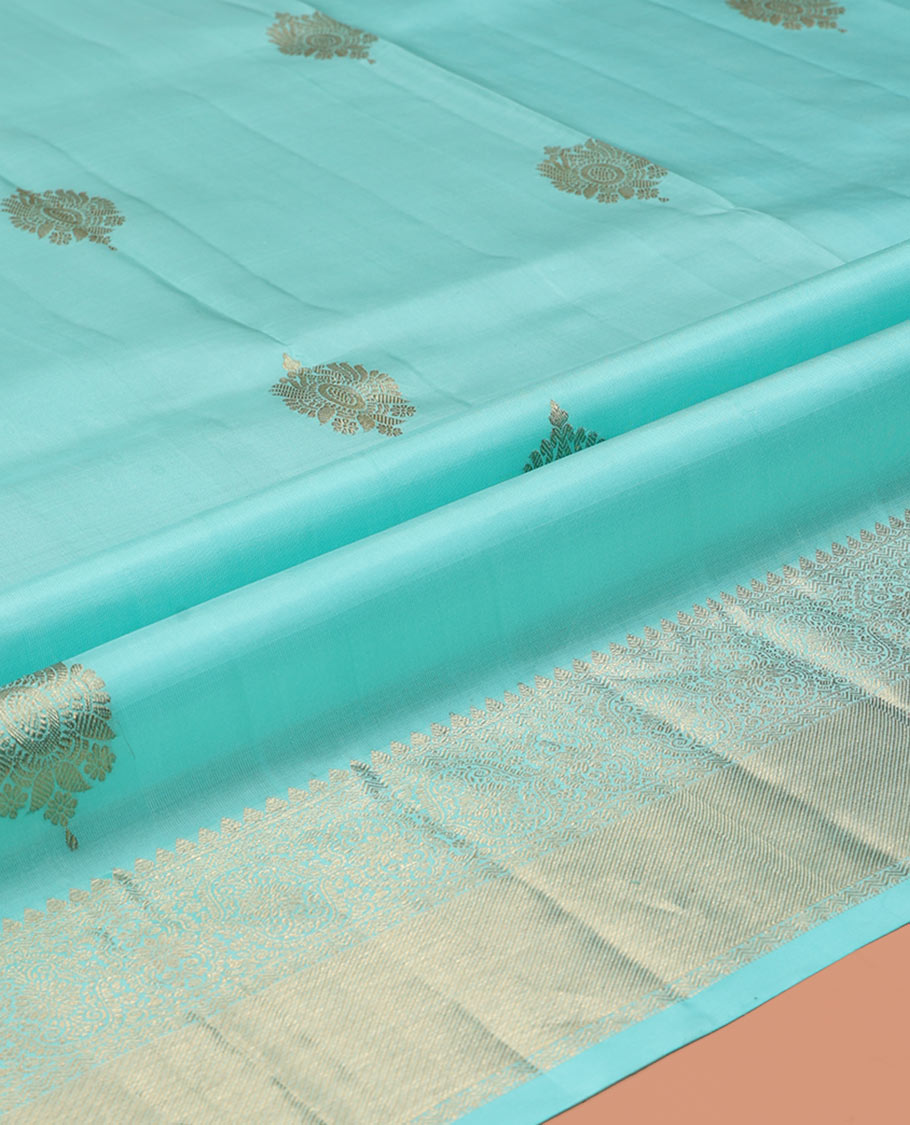 Blue Pure Silk Pavadai Material, Dazzled with Zari Buttas on Its Skirt, a Traditional Zari Border, and a Contrast Blouse